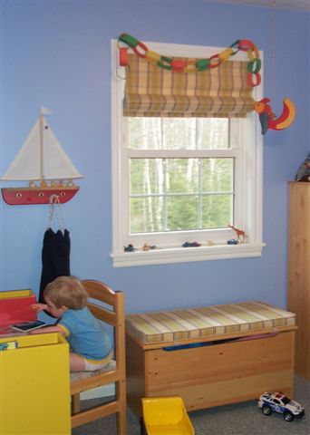 Childs room..roman shade.. matching cushion for toy box
