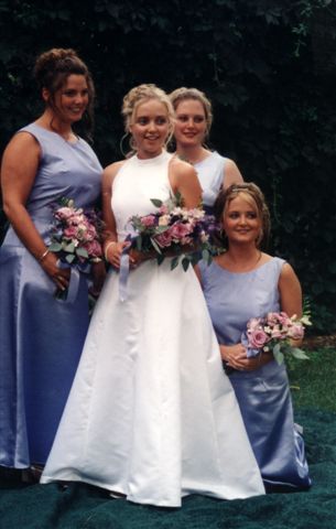 Satin wedding gown made from a drawing..bridesmaids wore blue skirts & tops
