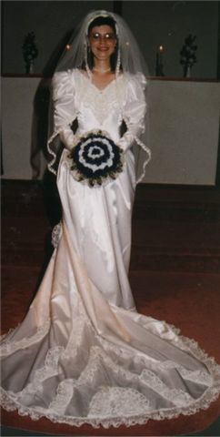 Satin gown ..lots of lace trim
